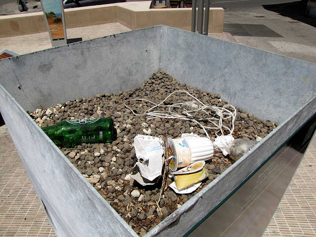 Decorated planters now trash cans, piazza Attias, Livorno