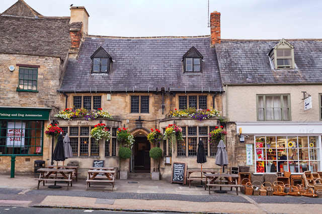 One of the many 16th century inns that line Burford High Street by Martyn Ferry Photography