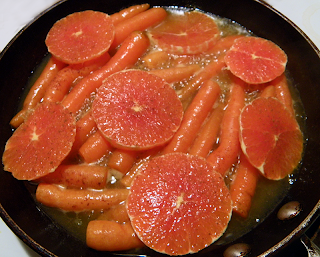 Carrots and Oranges Simmering in Skillet
