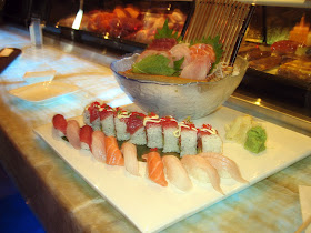A plate full of sushi and sashimi from Oishii Asian Fusion.