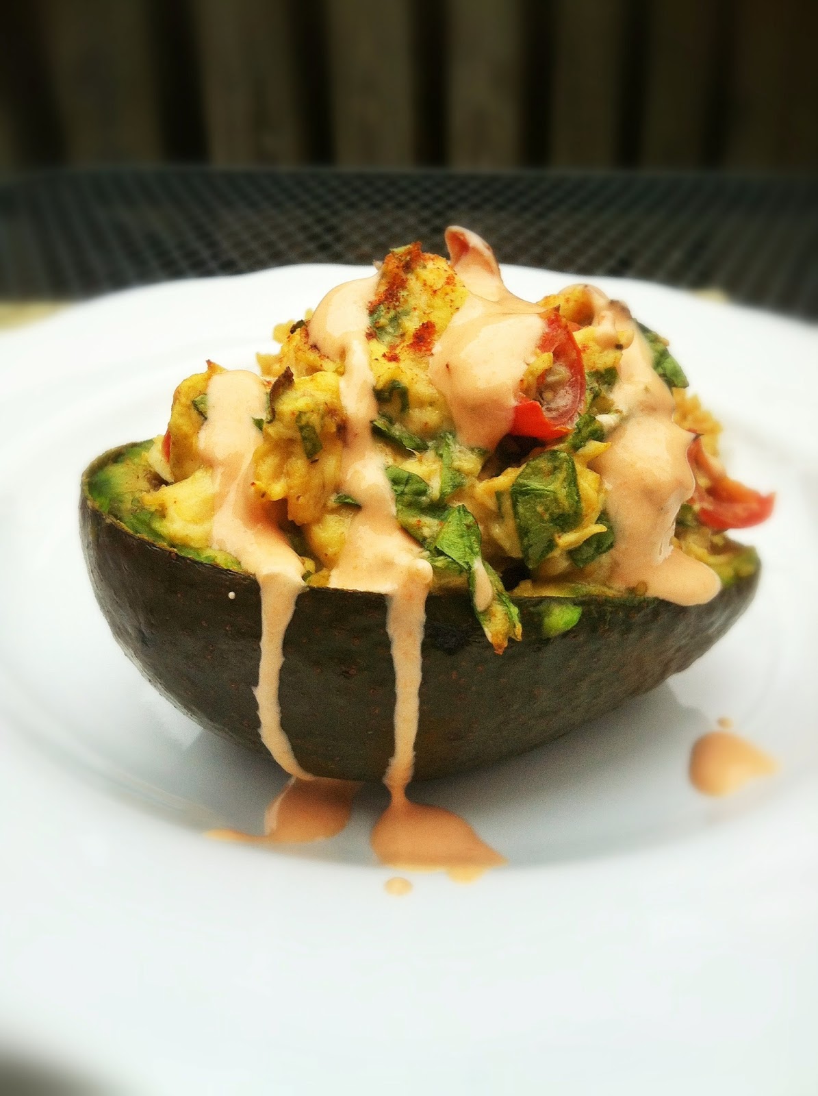 taylor made spicy chicken, spinach & tomato stuffed avocado with a