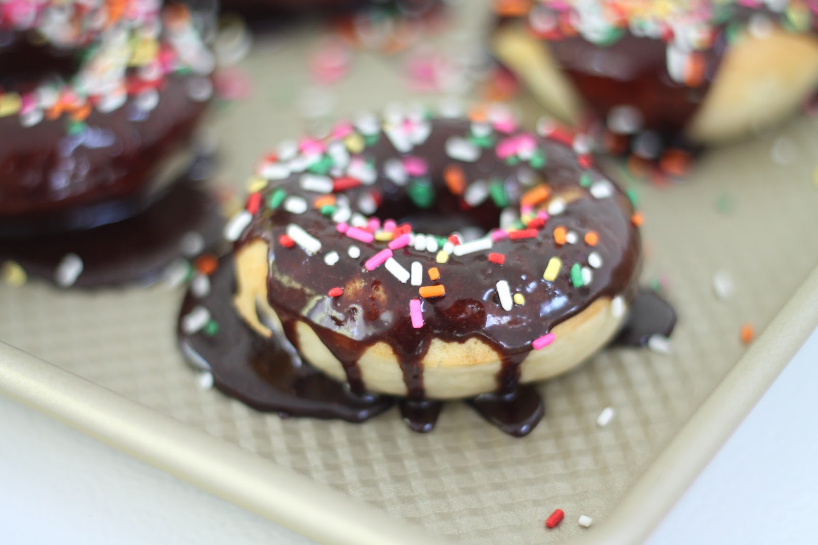Homemade Baked Doughnuts with Chocolate Icing & Sprinkles