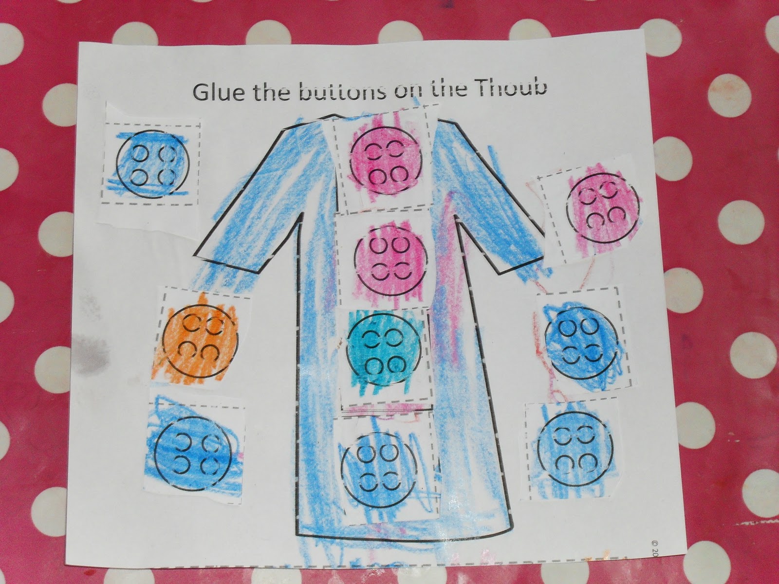 a muslim homeschool Cuting, sticking and number clothes!