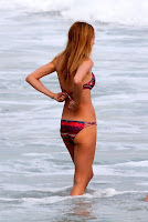 Heather Graham ties her bikini top