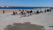 Concrete chairs and sun loungers by Barcelona beach (imag )