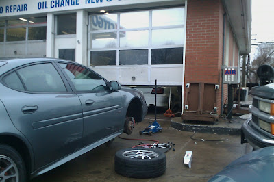 getting a used tire put on my car at a gas station getting a used tire put on my car at a gas station