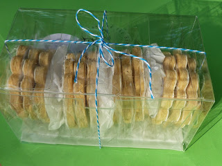 lemon-rosemary tea biscuits packaged in a crystal clear box