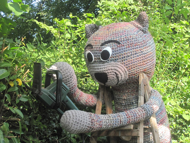 Fiddly Fingers crochet cat Chester cutting hedge 