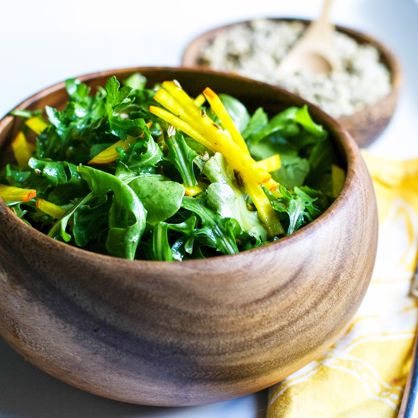 A spring salad with arugula, golden beets, and candied fennel seeds all tossed in a quick lemon vinaigrette. Perfect as a side to any meal. arugula, beets, fennel seeds, detox, healthy, spring, salad, easy, lemon, vinaigrette