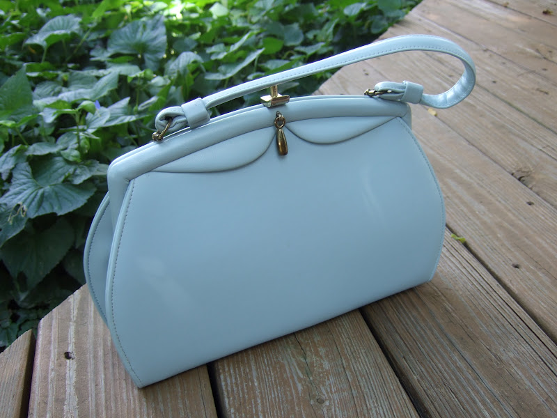 Vintage Girl Repairing The Vintage Handbag