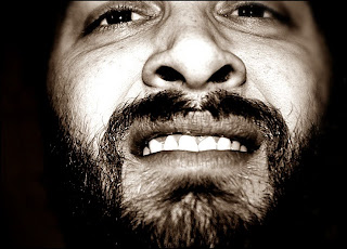 Bearded man with awkward expression Bearded man with awkward expression