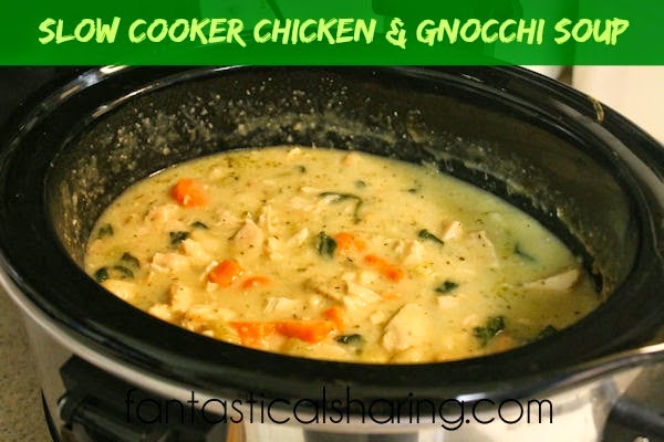 Slow Cooker Chicken & Gnocchi Soup | Creamy & garlicky soup with bits of gnocchi, chicken, carrots, and spinach! YUM! #recipe