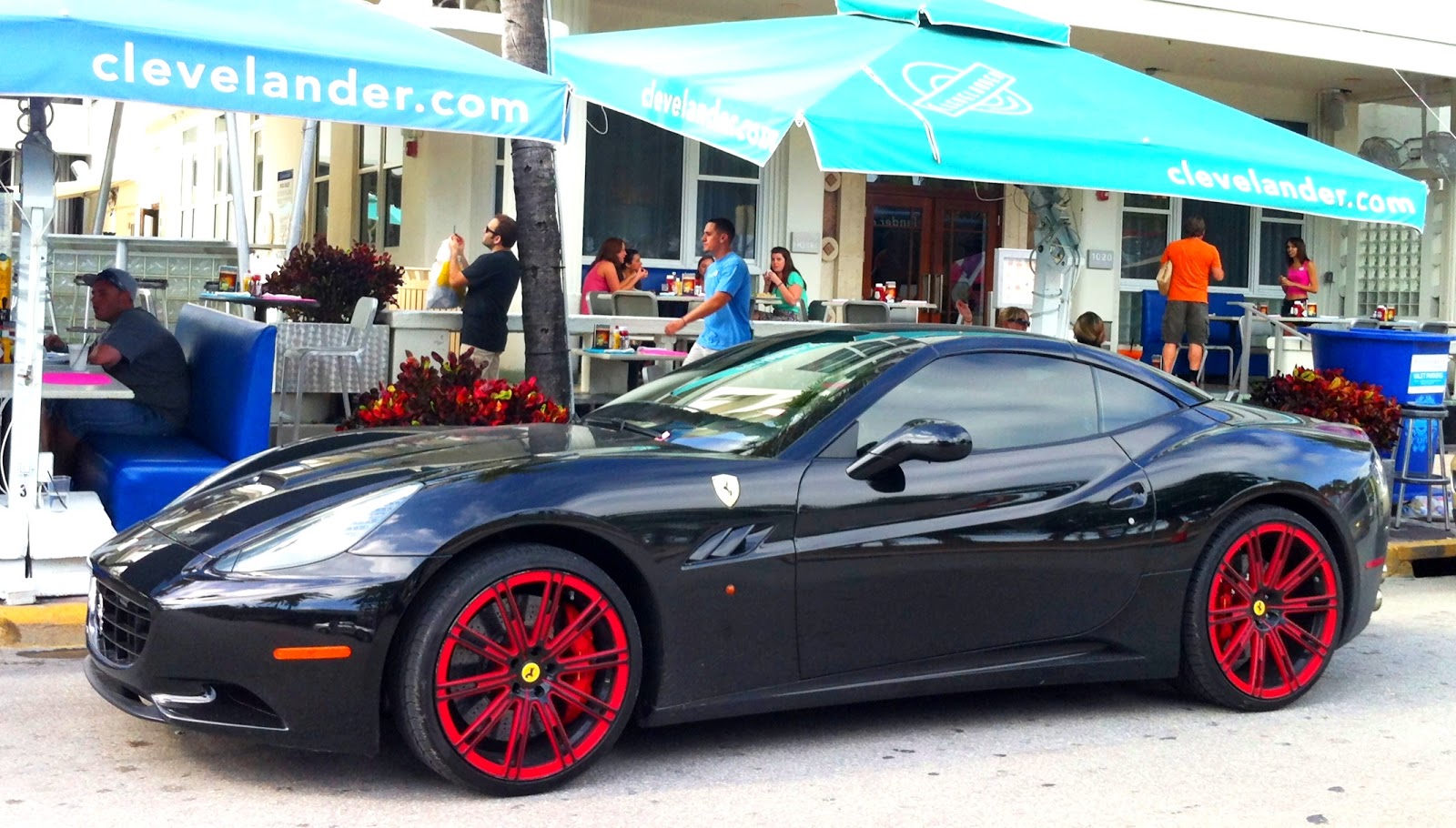Black Ferrari California red rims Exotic Cars on the Streets of Miami