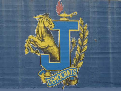 Painted school mascot with large J and bucking donkey, scroll with word DEMOCRATS