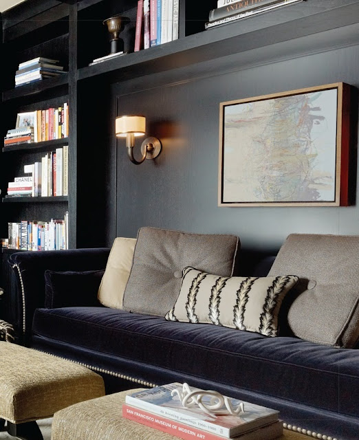 a perfect gray sofa nook in a builtin bookcase