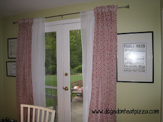Red curtains against light green walls - thediybungalow.com
