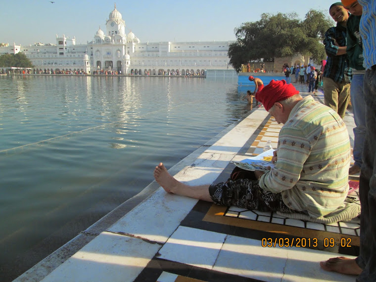 A artist painting the "Golden Temple".