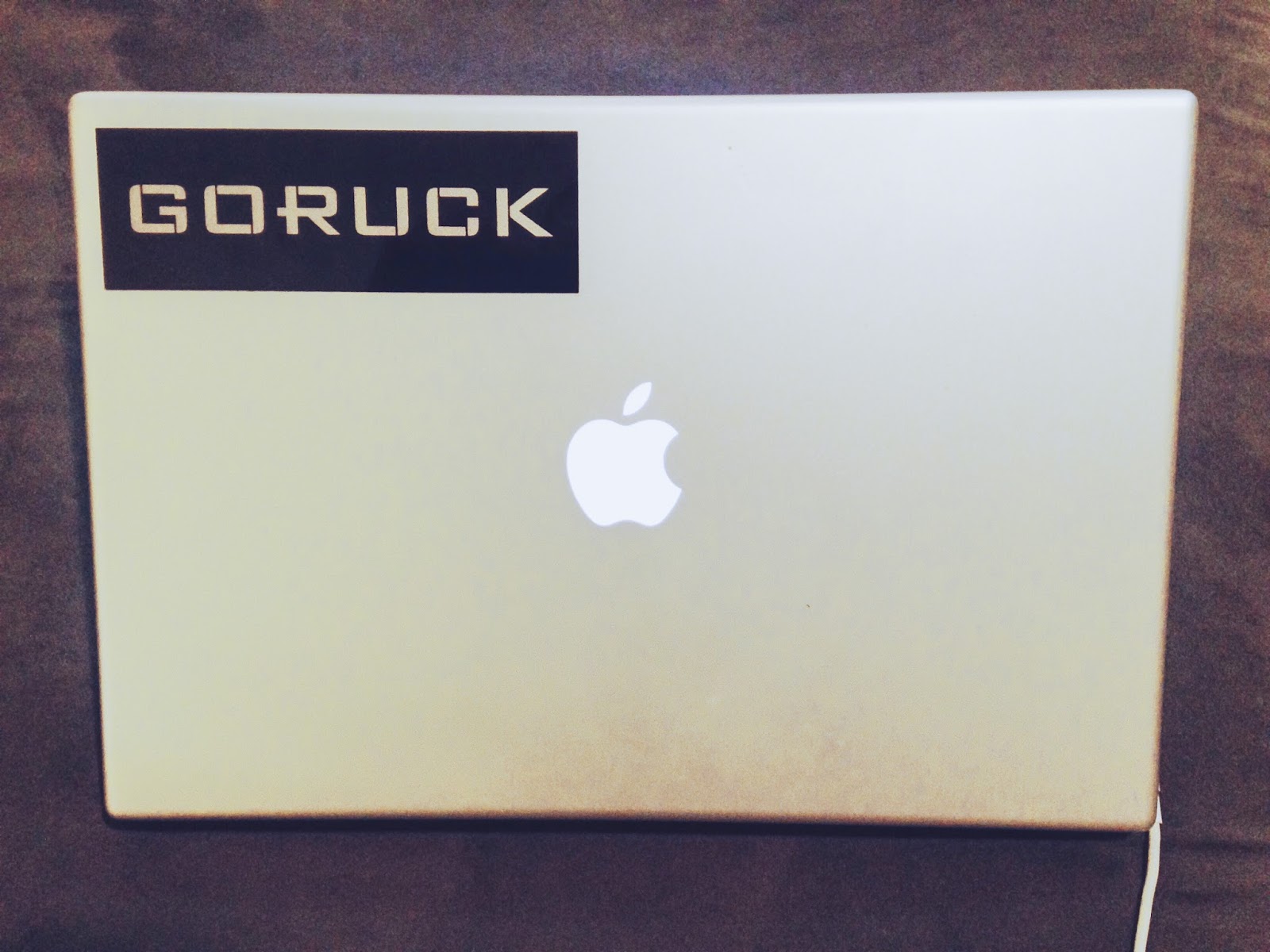 Photo of mac book pro with sticker