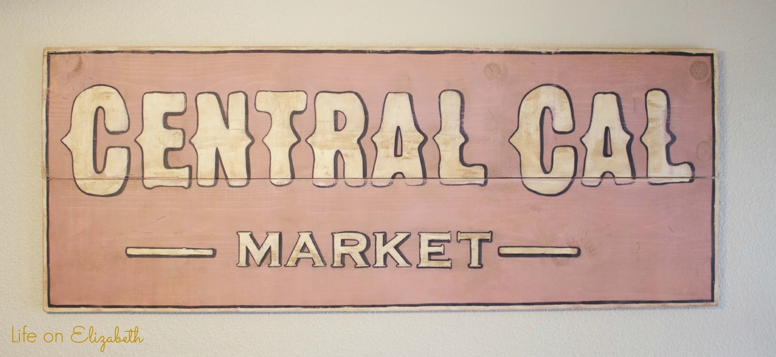 an antique sign i made using folkart home decor chalk paint