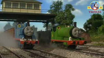 Thomas the train engine at a railway track-junction signal light steam train Percy the small engine