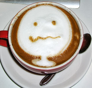 smiling face on coffee