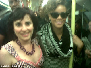 Pictures Of Rihanna riding the London tube with her fans: Damn she couldnt even get a seat. 2