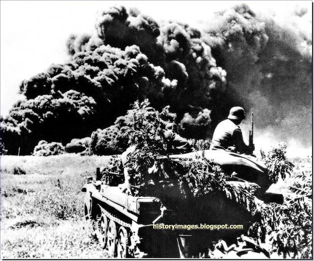 German soldiers  armored Sd.Kfz.251 Maiko oilfields burning August 1942