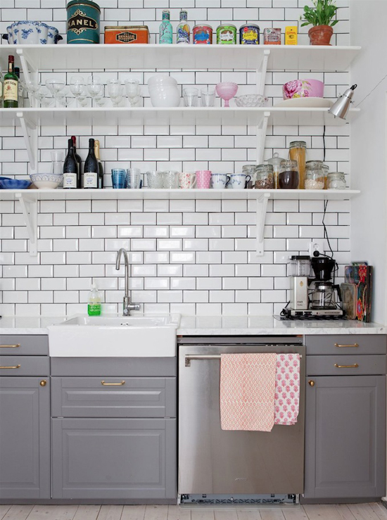 Kitchen subway tiles and open shelving. Photo via Bolaget.