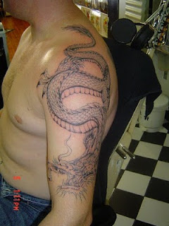 Guy with Dragon Tattoo on Shoulder and Arms