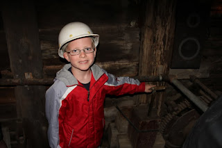 boy in a mine with a hard hat