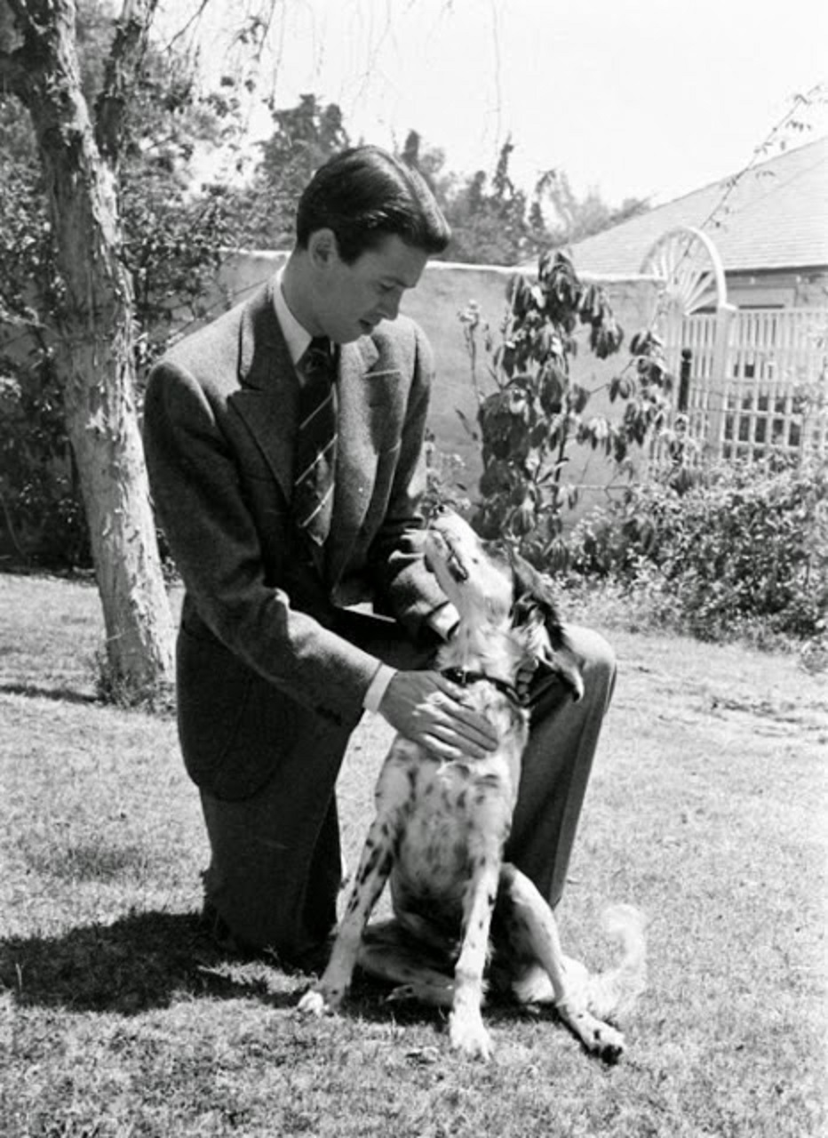 Jimmy Stewart with his dog in the yard.