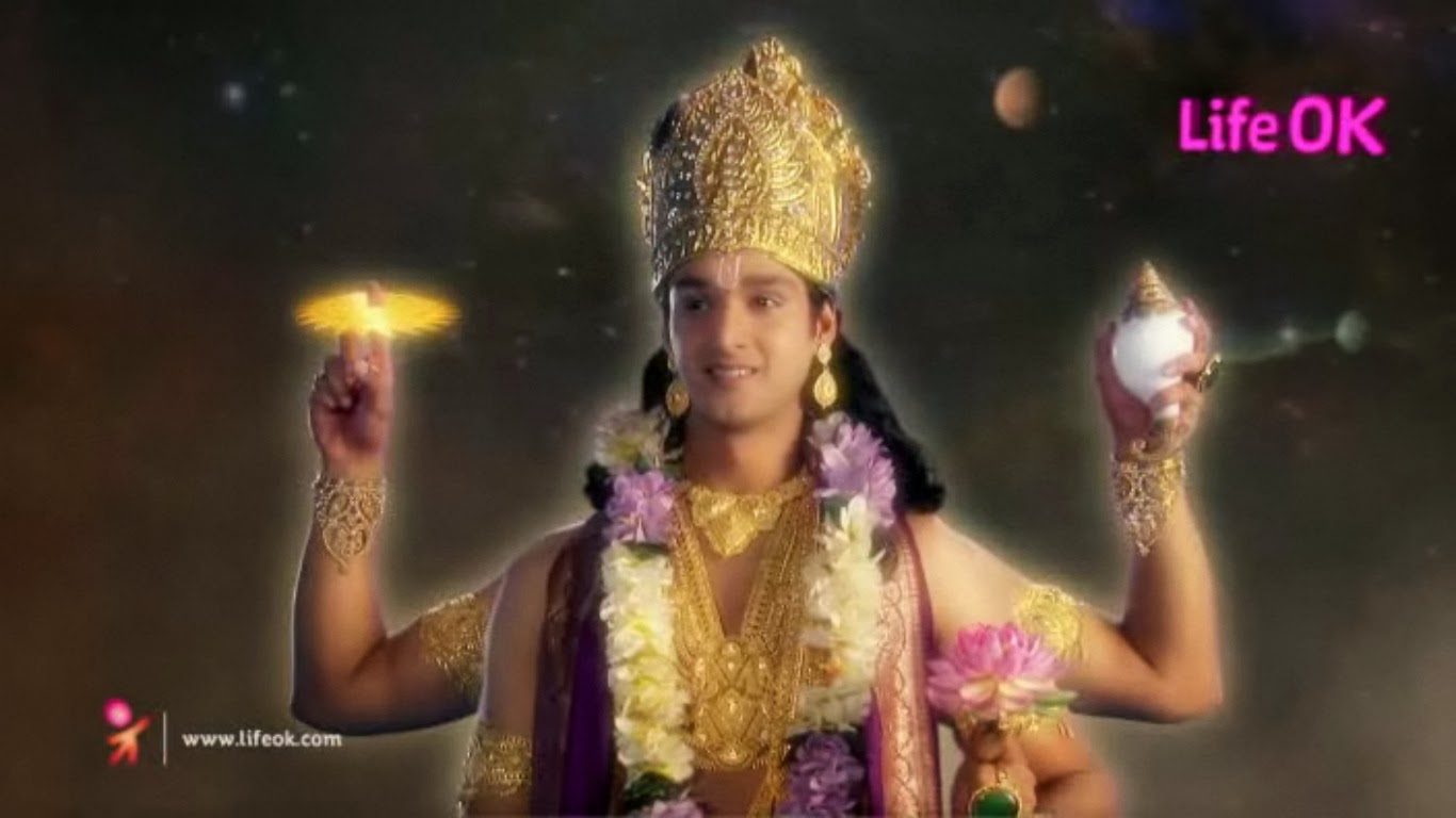 What does Vishnu hold in his hands?
