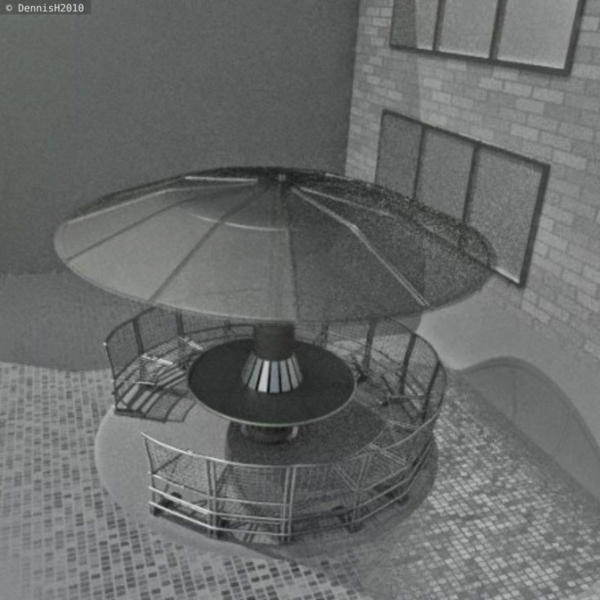  A round bench made of stainless steel with a rigged rain/sun protection by DennisH2010