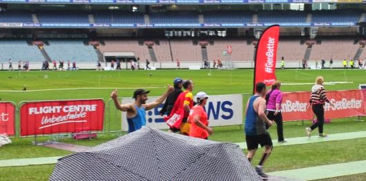 Giving the thumbs up to my family at the finish inside the MCG