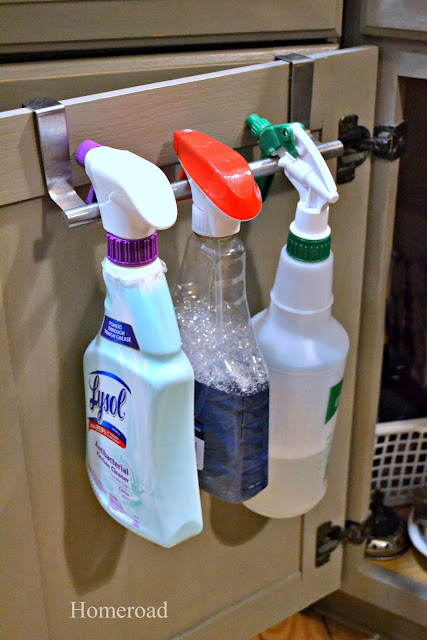 11 Ways to Organized with Towel Rods -- holding spray bottles on back of the door:: OrganizingMadeFun.com