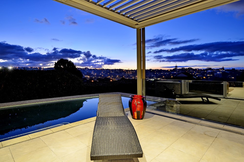 Photo of swimming pool and the view from the terrace at sunset
