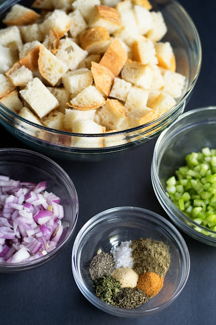 All of the ingredients needed to make the stuffing in bowls.  