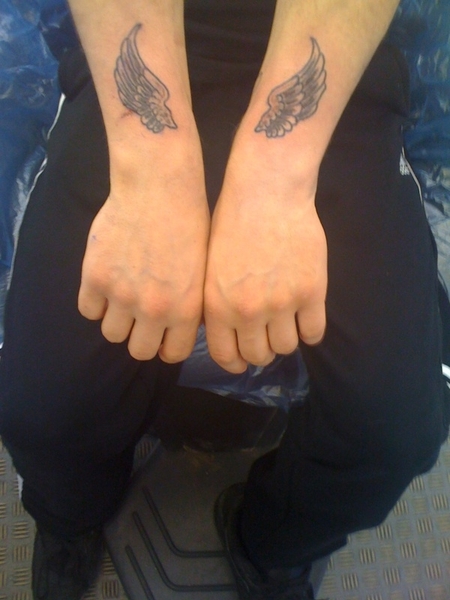 We think small wing tattoos Angel Wings Tattoo Wrist