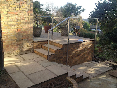 Extended terrace, re laid with Raj Green Indian Sandstone