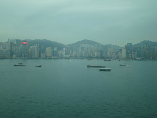 a city skyline with boats in the water