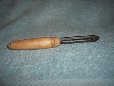 vintage-potato-peeler-with-wooden-handle