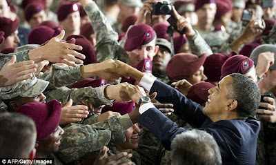 President+Obama+shakes+hands+with+troops+following+his+speech+in+the+plane+hanger+at+the+military+base.+'I+am+proud+to+say+these+two+words,'+he+had+said+in+the+address.+'Welcome+home'.jpg