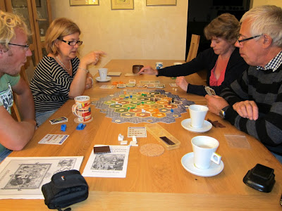 The players during the Settlers of Catan game