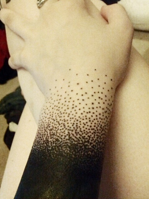 Dotted tattoo on arm 