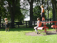 shirtless schoolchildren playing in the park