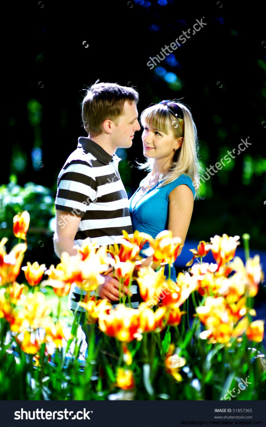 Lover Man And Girl Among Red Yellow Flowers In Spring Park Stock Lover Man And Girl Among Red Yellow Flowers In Spring Park Stock