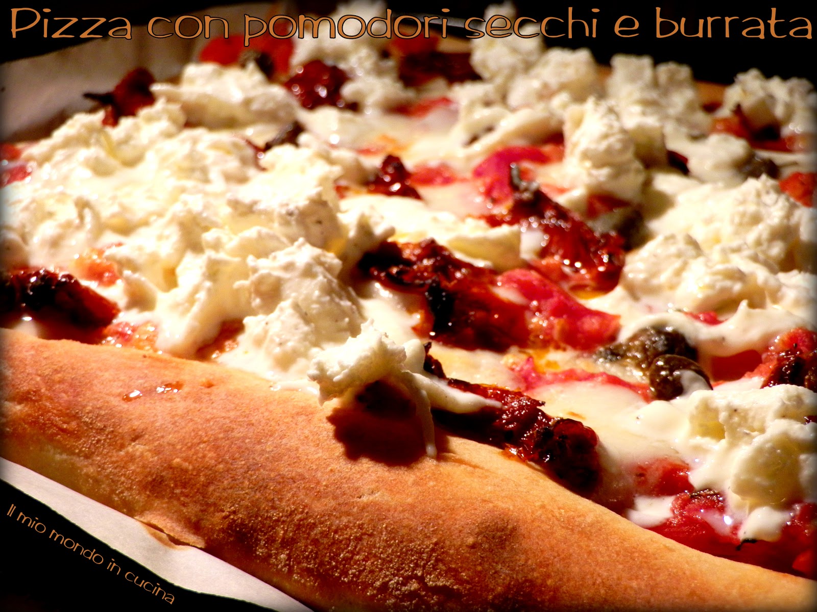 PIZZA CON POMODORI SECCHI, BURRATA E CAPPERI DI PANTELLERIA