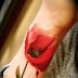 RED ROSE TATTOO ON HAND WITH LEAF