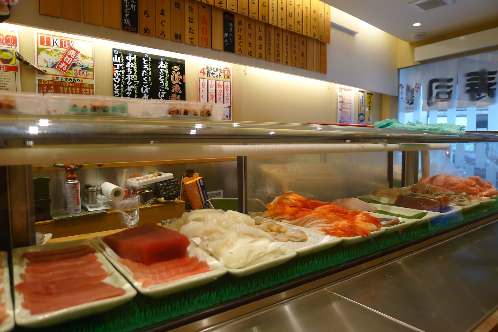 Tokyo Belly IKEBUKURO Uogashi Nippon Ichi Standing Sushi... Friendly staff with Jazzy BGM