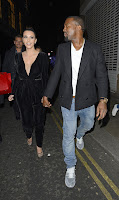 Kim Kardashian and Kanye West holding hands